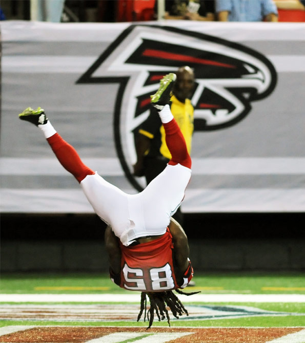 Atlanta Falcons player flipping for a touchdown. Earnie creative design